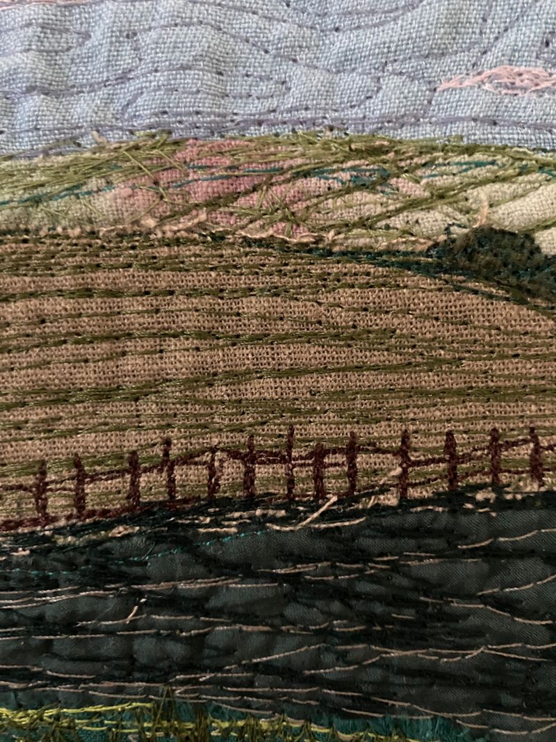 Close up detail of machine stitched landscape