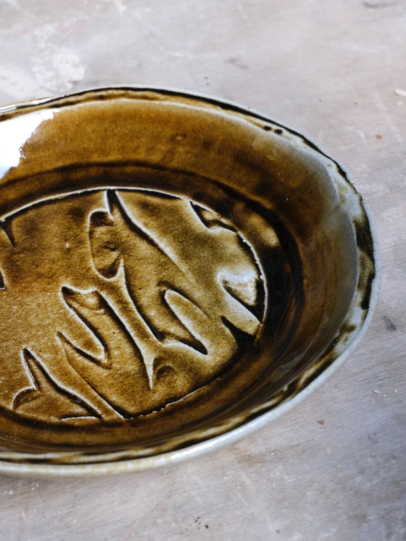 Salt-fired plate by Isabelle Proffitt