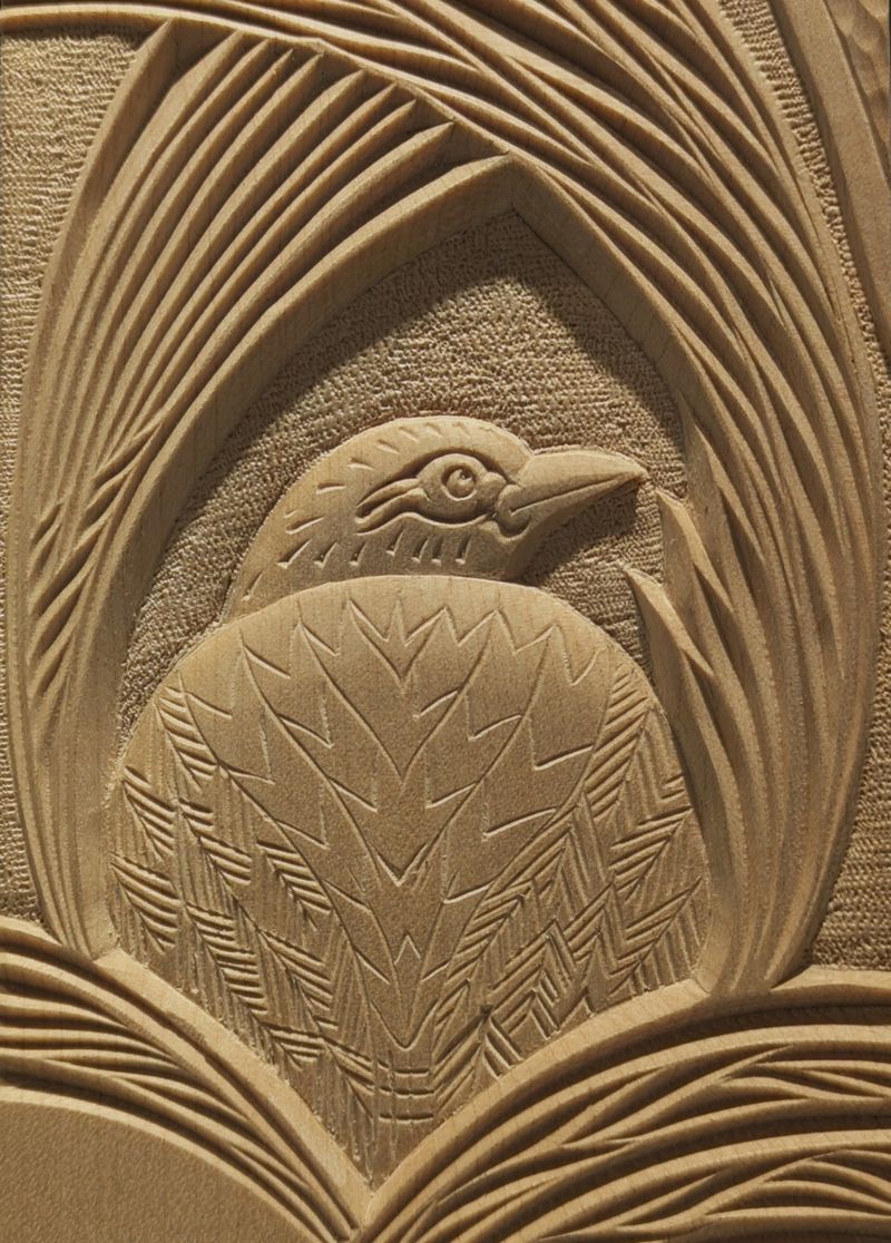Carved sycamore mirror detail