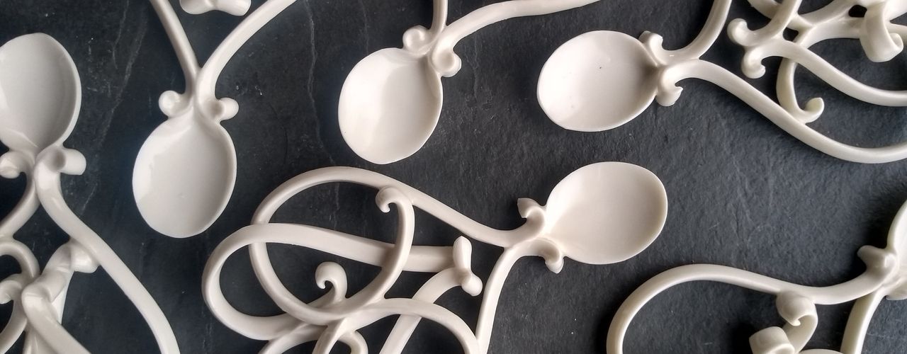 Delicate hand made porcelain love spoons.
