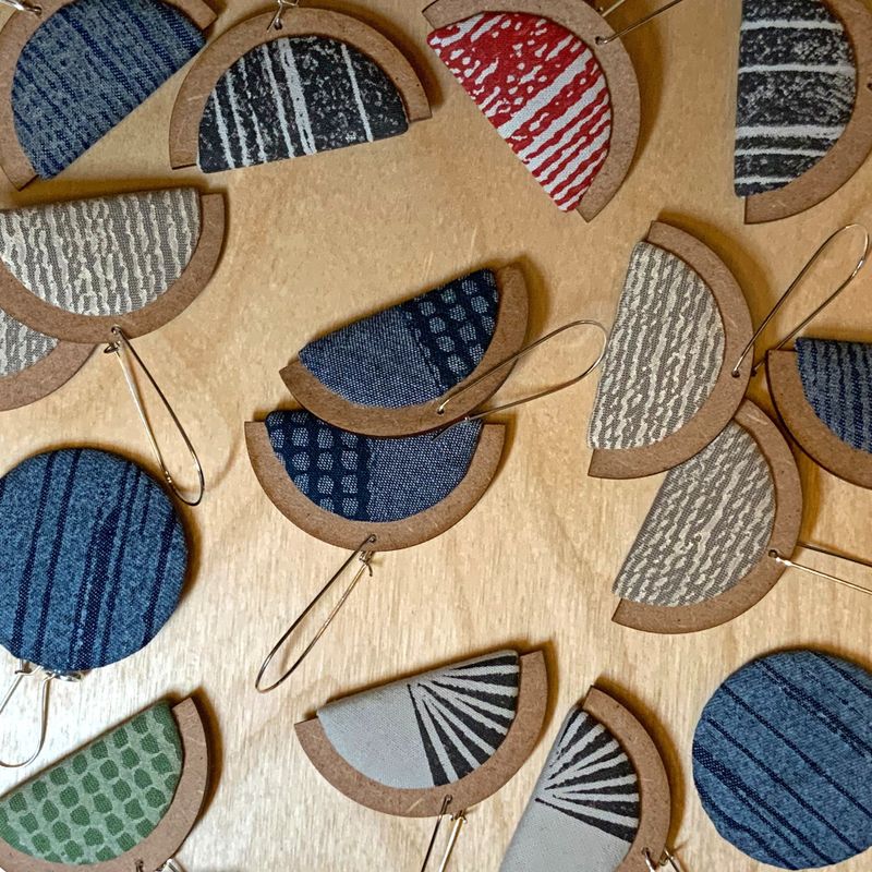 A scattering of hand-printed earrings