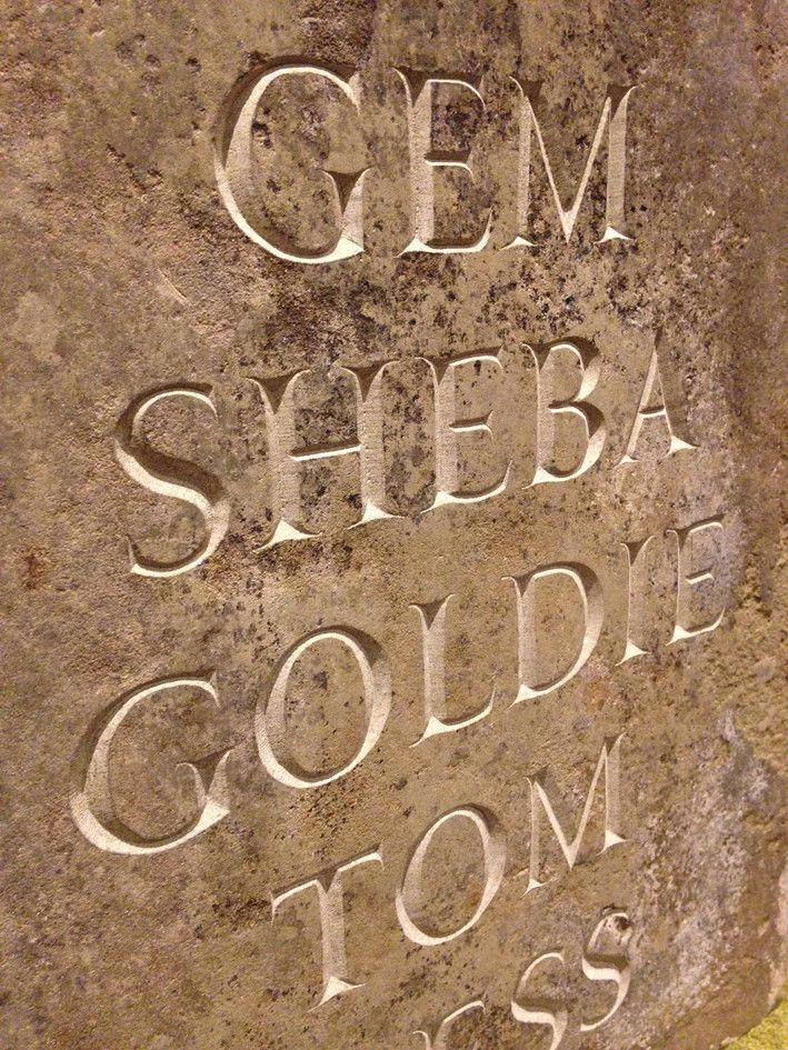 lettering cut in an old flagstone