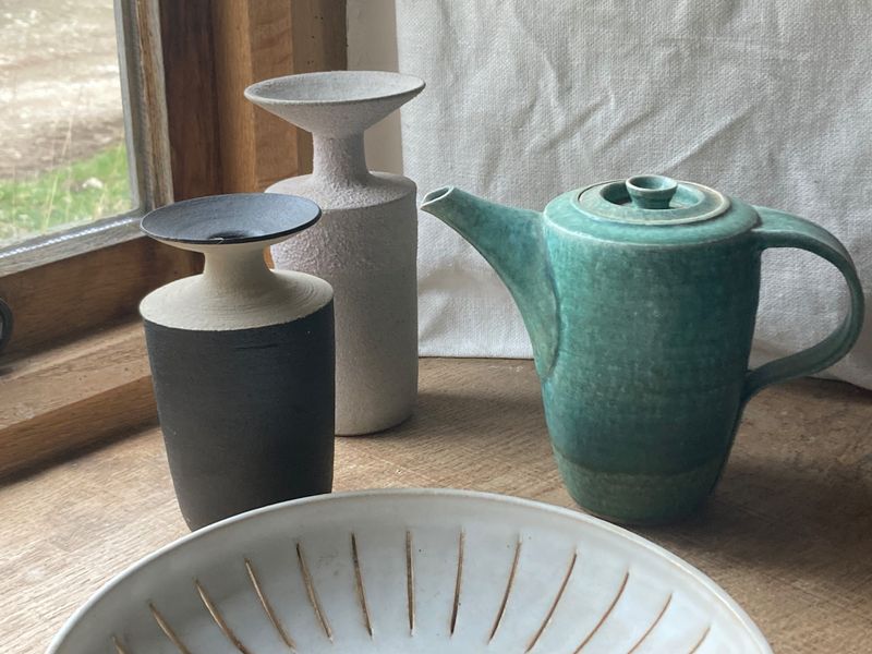 Bottles, coffee pot and pierced bowl.