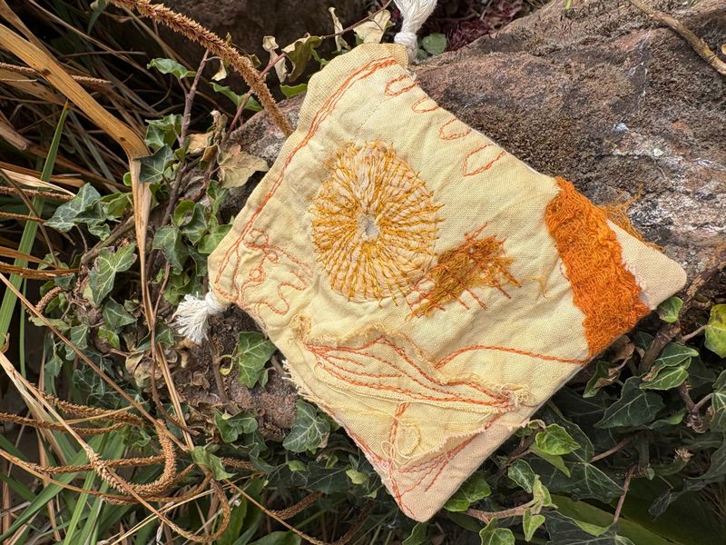 Drawstring Pouch featuring free motion machine embroidery detail on plant dyed fabrics