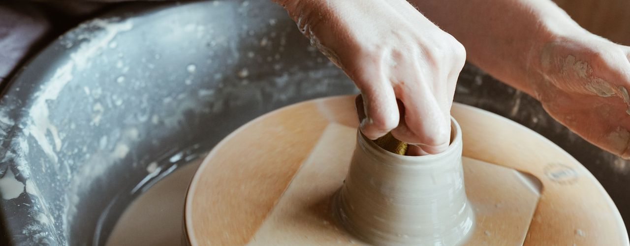 Faye Wellon throwing on the pottery wheel