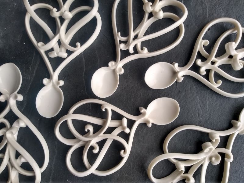 Delicate hand made porcelain love spoons.