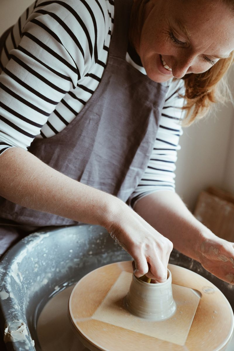 Faye Wellon throwing on the pottery wheel