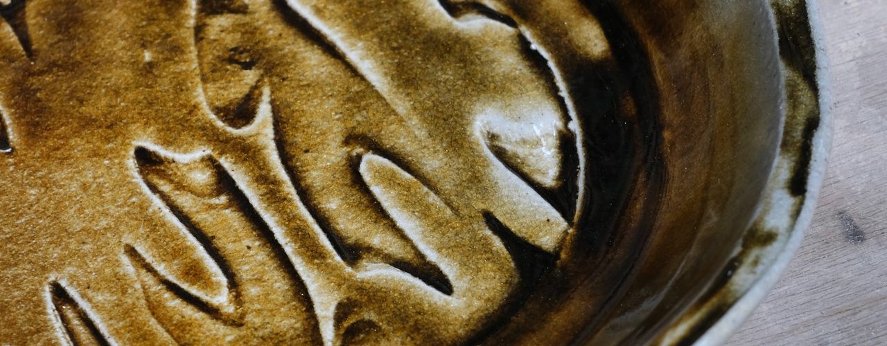 Salt-fired plate by Isabelle Proffitt